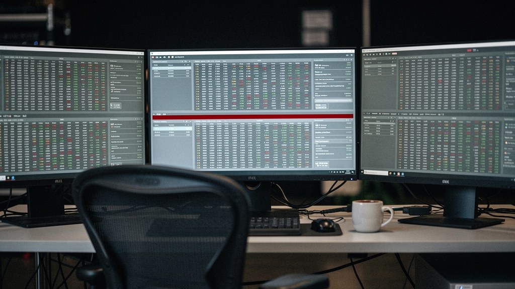 An automated operations room with monitoring screens and an empty chair, suggesting no one is watching in real time