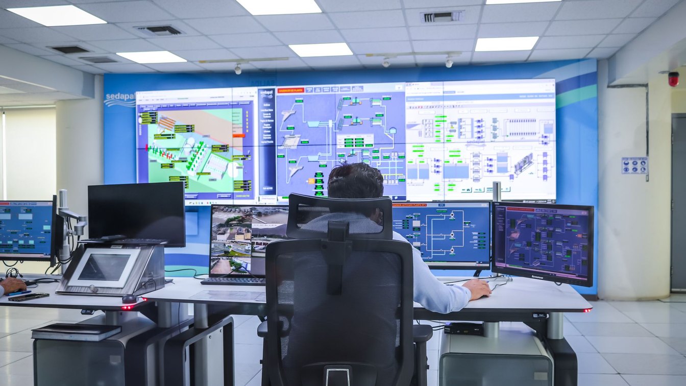 An analyst monitoring dashboards in a security operations center